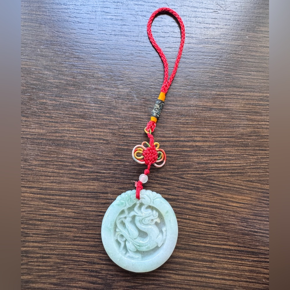 Elegant Jade Pendant with Red Cord